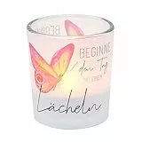 Windlichtglas mit Motiv auf Einer transparenten Banderole, inkl. 1 Teelicht, H/Ø: 6,5 x 6 cm, Motiv: Beginne den Tag mit einem Lächeln.