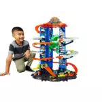 Hot Wheels GJL14 City Robo T Rex Megacity Parkgarage mit Spielzeug Dinosaurier inkl. 2 Spielzeugautos & FTB67 - City Ultimative Autowaschanlage mit Krokodil
