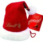 Lindt Schokolade LINDOR Milch, Vollmilch Kugeln, Weihnachtsmann-Mütze mit Schokoladen-Kugeln mit zartschmelzender Füllung
