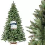 FAIRYTREES künstlicher Weihnachtsbaum Nordmanntanne Premium mit Holzständer